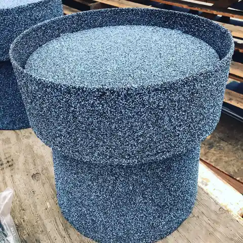 A harbor blue stone coated vent cap on a shop bench